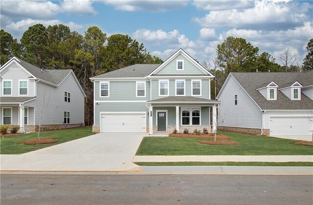 view of front of property with covered porch, a garage, central AC, and a front lawn