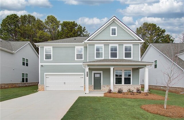 craftsman inspired home featuring central AC unit, a front yard, and a garage