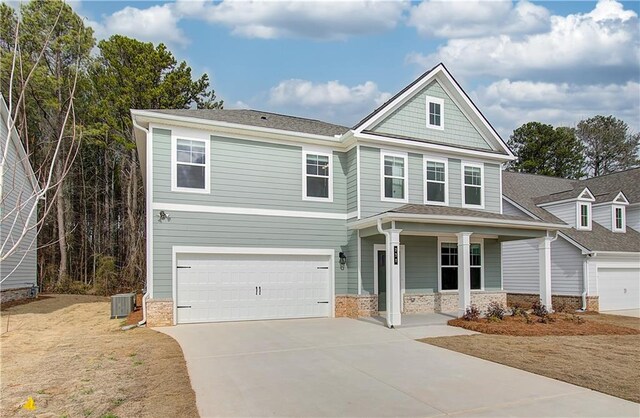 view of front of house with a garage and a front lawn