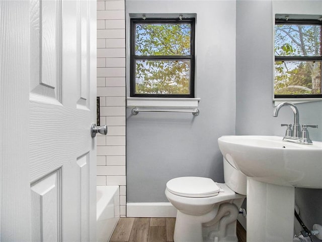 bathroom with toilet and shower / washtub combination