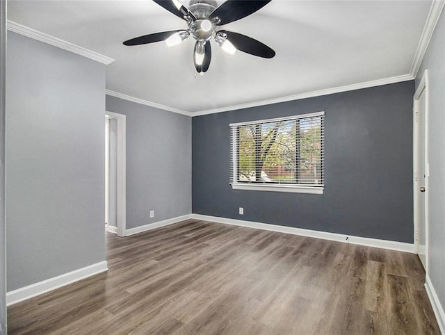 spare room with hardwood / wood-style floors, ceiling fan, and ornamental molding