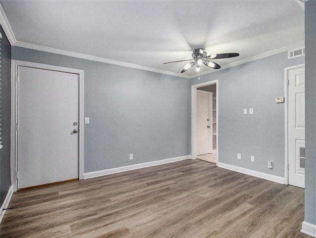 unfurnished room with ceiling fan, hardwood / wood-style floors, and crown molding