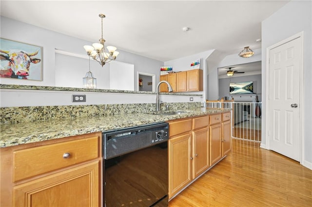 5989 Turfway Park Ct, Sugar Hill, GA 30518 - kitchen with black dishwasher, a sink, light wood-style floors, a ceiling fan, and a chandelier