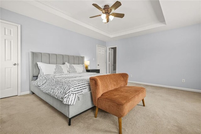 5989 Turfway Park Ct, Sugar Hill, GA 30518 - bedroom featuring a tray ceiling, carpet flooring, baseboards, ornamental molding, and ceiling fan