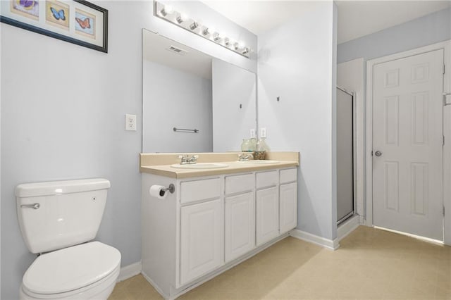 5989 Turfway Park Ct, Sugar Hill, GA 30518 - full bathroom with double vanity, toilet, an enclosed shower, and baseboards