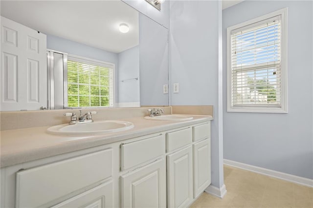 5989 Turfway Park Ct, Sugar Hill, GA 30518 - bathroom with double vanity and baseboards