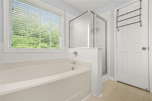 5989 Turfway Park Ct, Sugar Hill, GA 30518 - full bathroom featuring plenty of natural light, a bath, and a stall shower