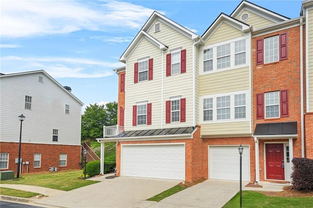 5989 Turfway Park Ct, Sugar Hill, GA 30518 - view of property with brick siding, driveway, a garage, and a standing seam roof