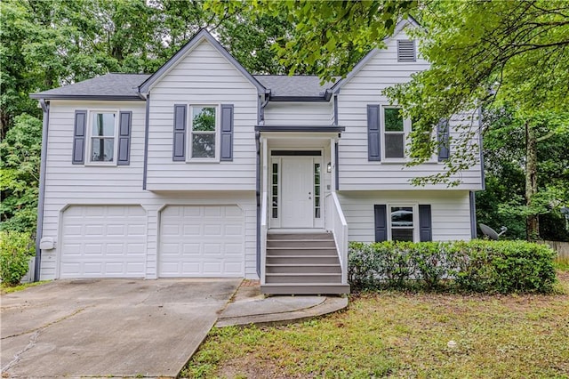 159 Aztec Way SE, Acworth, GA 30102 - split foyer home featuring a garage, concrete driveway, and a shingled roof
