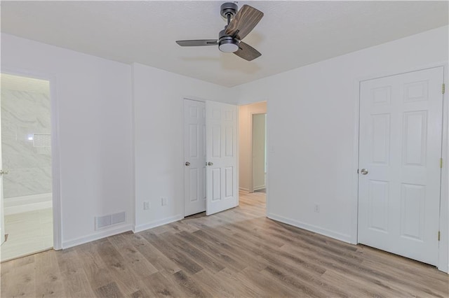 159 Aztec Way SE, Acworth, GA 30102 - unfurnished bedroom featuring light wood-style floors, baseboards, and ensuite bath