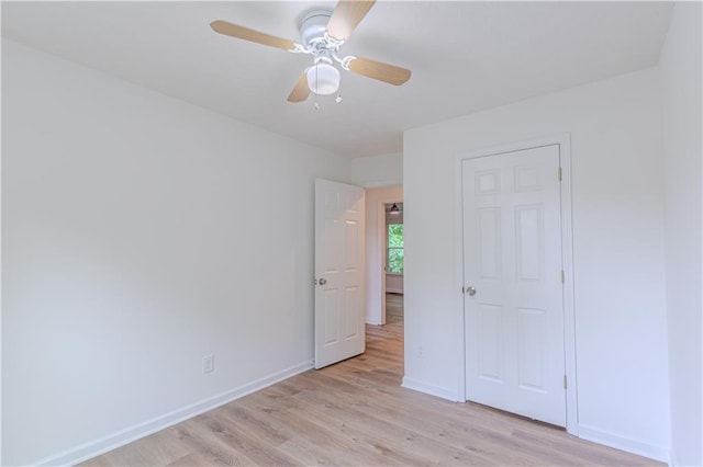 159 Aztec Way SE, Acworth, GA 30102 - unfurnished bedroom featuring light wood-style flooring, baseboards, and ceiling fan