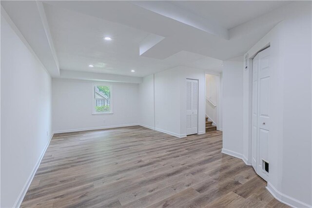 159 Aztec Way SE, Acworth, GA 30102 - unfurnished room with wood finished floors, baseboards, recessed lighting, and stairway