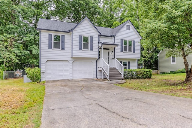 159 Aztec Way SE, Acworth, GA 30102 - bi-level home featuring an attached garage, concrete driveway, and a shingled roof