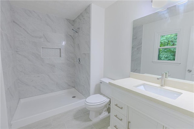159 Aztec Way SE, Acworth, GA 30102 - full bathroom featuring toilet, vanity, a tile shower, and tile patterned floors
