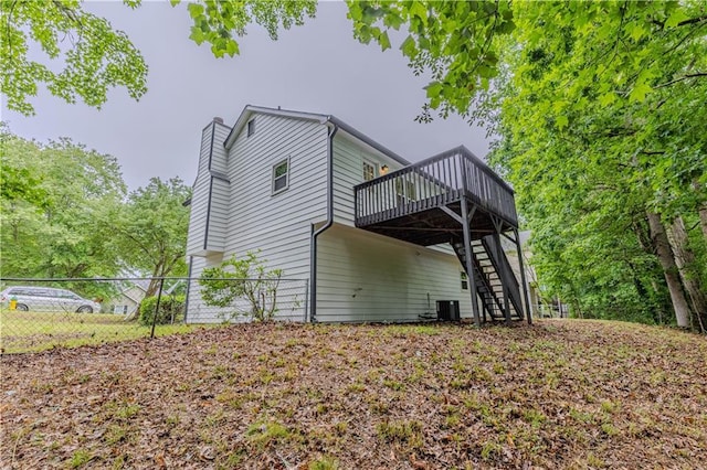 159 Aztec Way SE, Acworth, GA 30102 - back of property featuring stairs, a wooden deck, a chimney, and cooling unit