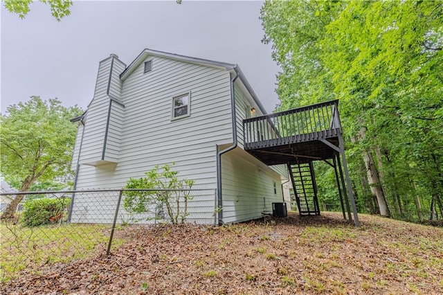 159 Aztec Way SE, Acworth, GA 30102 - view of property exterior featuring stairway, a deck, a chimney, and central AC unit