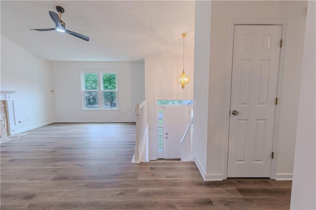 159 Aztec Way SE, Acworth, GA 30102 - foyer featuring wood finished floors, baseboards, ceiling fan, and a chandelier