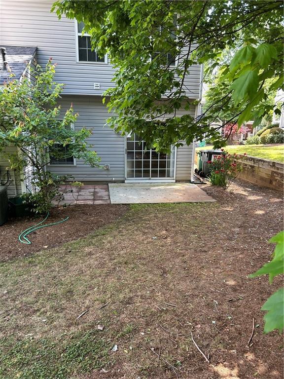 9165 Nesbit Ferry Rd # 9, Alpharetta, GA 30022 - back of house featuring a patio