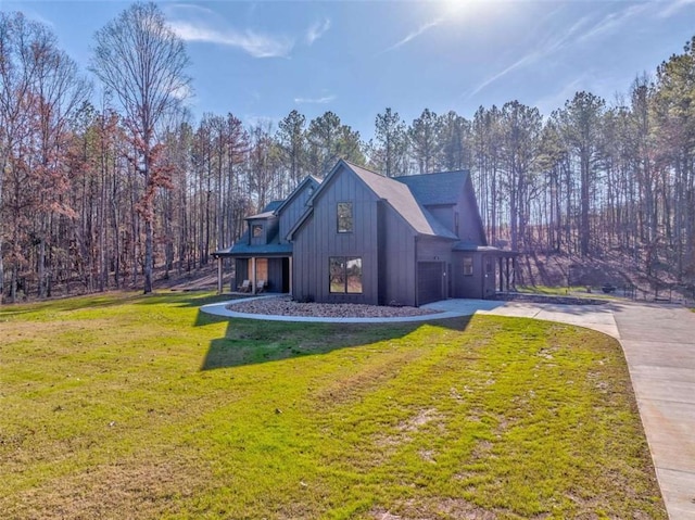 view of side of home with a lawn