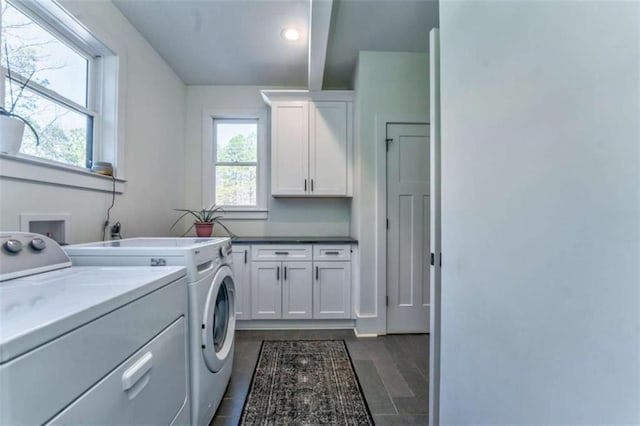 laundry area with cabinets and independent washer and dryer