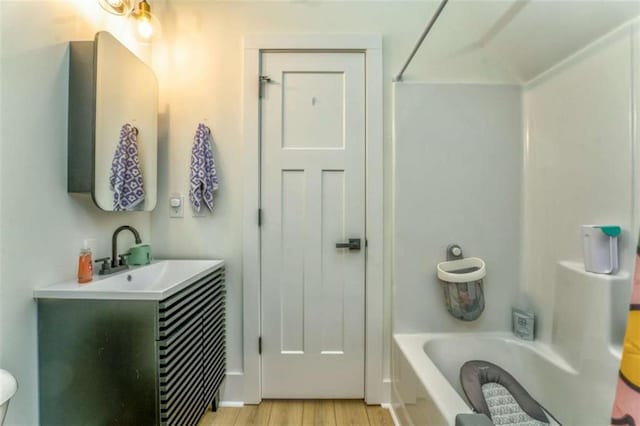 bathroom featuring hardwood / wood-style flooring and vanity