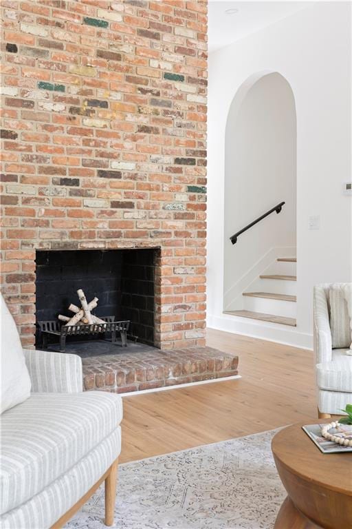 2873 Bob White Dr SW, Atlanta, GA 30311 - living room featuring wood finished floors, a fireplace, baseboards, and stairs
