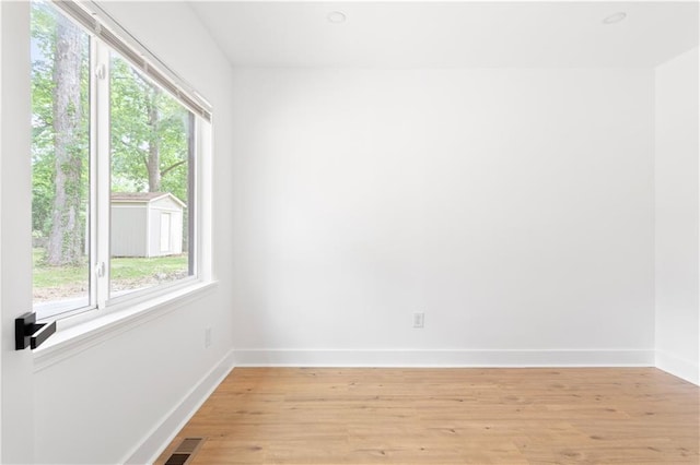 2873 Bob White Dr SW, Atlanta, GA 30311 - spare room with plenty of natural light, light wood-type flooring, and baseboards