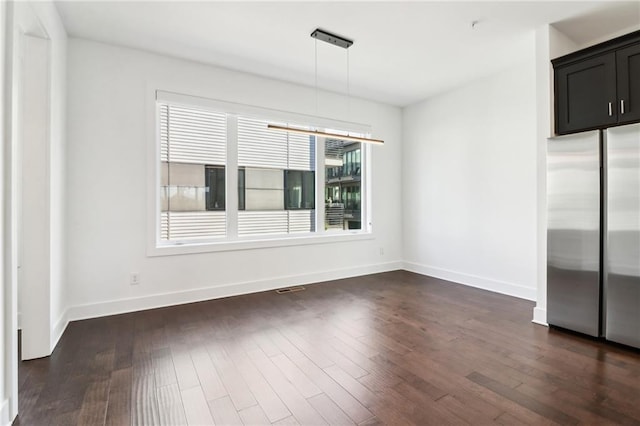 443 Plateau Pl NW, Atlanta, GA 30309 - unfurnished dining area with baseboards, dark wood-style flooring, and visible vents