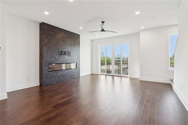 443 Plateau Pl NW, Atlanta, GA 30309 - unfurnished living room featuring baseboards, recessed lighting, a premium fireplace, a ceiling fan, and wood finished floors