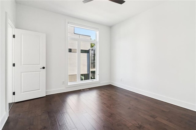 443 Plateau Pl NW, Atlanta, GA 30309 - empty room with dark wood finished floors, visible vents, baseboards, and ceiling fan