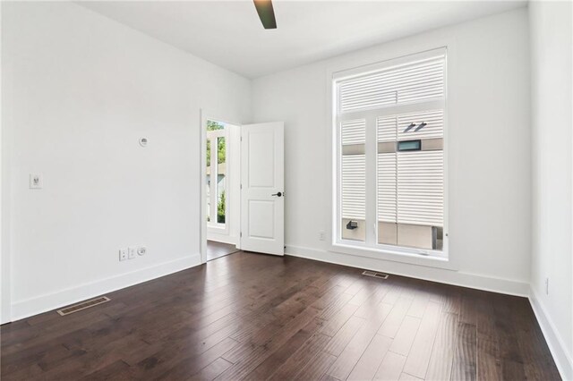 443 Plateau Pl NW, Atlanta, GA 30309 - spare room featuring dark wood finished floors, baseboards, a ceiling fan, and visible vents