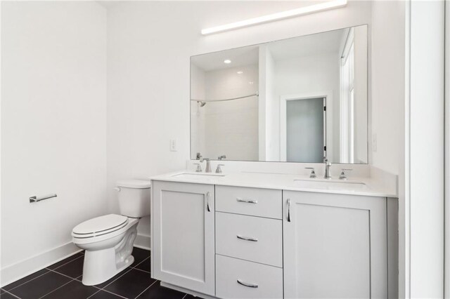 443 Plateau Pl NW, Atlanta, GA 30309 - bathroom with tile patterned flooring, toilet, baseboards, and a sink
