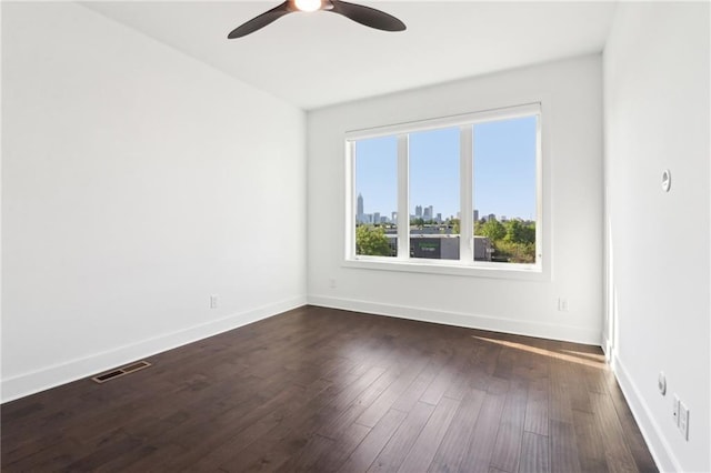 443 Plateau Pl NW, Atlanta, GA 30309 - unfurnished room with ceiling fan, visible vents, baseboards, and dark wood-style flooring