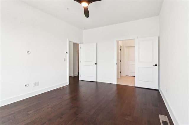 443 Plateau Pl NW, Atlanta, GA 30309 - unfurnished bedroom featuring baseboards, wood finished floors, visible vents, and a ceiling fan