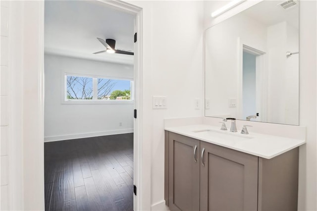 443 Plateau Pl NW, Atlanta, GA 30309 - bathroom featuring wood finished floors, visible vents, a ceiling fan, vanity, and baseboards