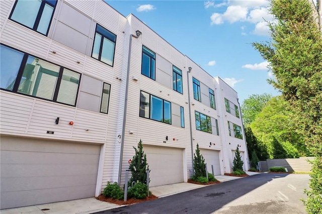 443 Plateau Pl NW, Atlanta, GA 30309 - view of property with driveway and a garage