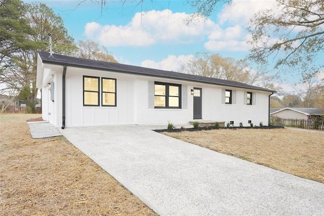 ranch-style house with a front yard