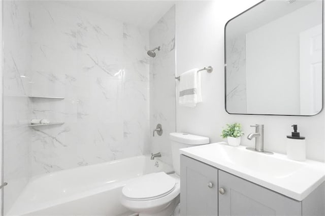 full bathroom with vanity, toilet, and tiled shower / bath combo