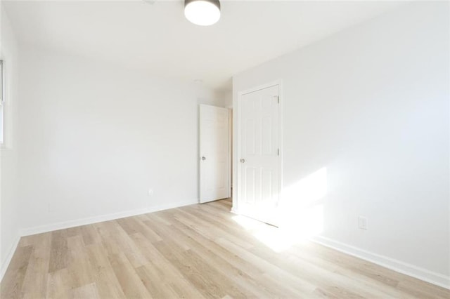 spare room featuring light wood-type flooring