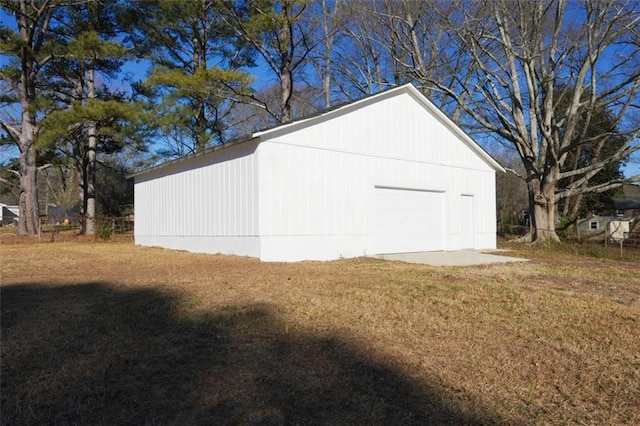 garage featuring a yard