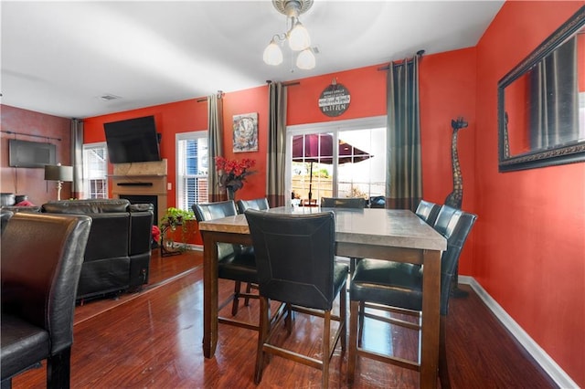 dining space featuring a chandelier and wood-type flooring