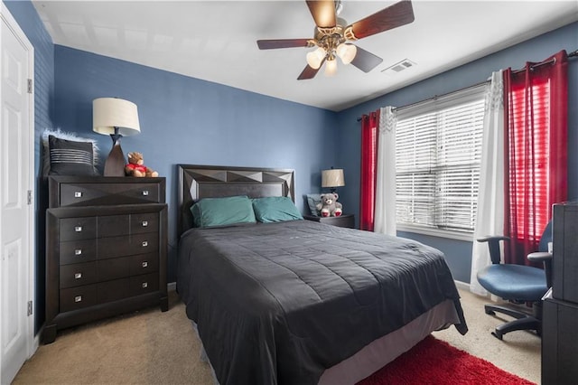 bedroom featuring ceiling fan and light colored carpet