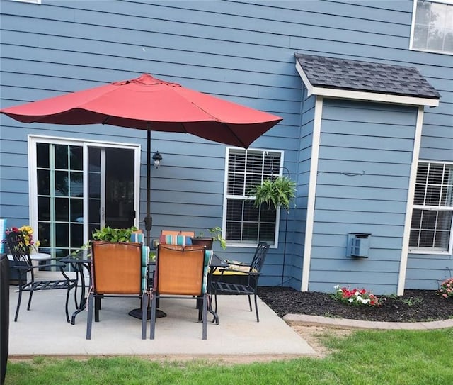 back of property featuring a yard and a patio