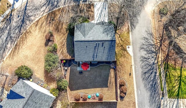 back of house with a lawn and a patio