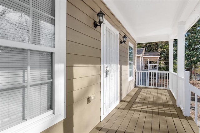 wooden terrace with a porch