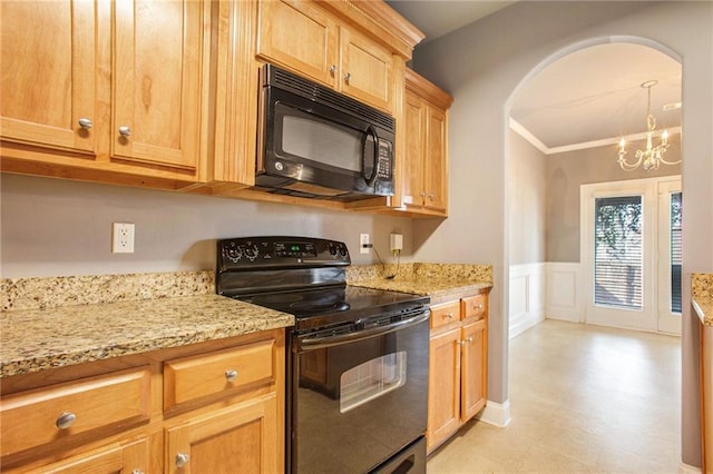 kitchen with a notable chandelier, ornamental molding, light stone countertops, and black appliances