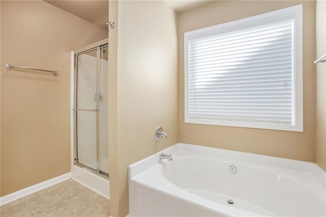 bathroom featuring independent shower and bath