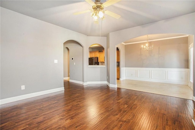 spare room featuring dark hardwood / wood-style flooring and ceiling fan