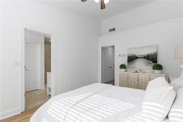 bedroom with ceiling fan and light hardwood / wood-style flooring