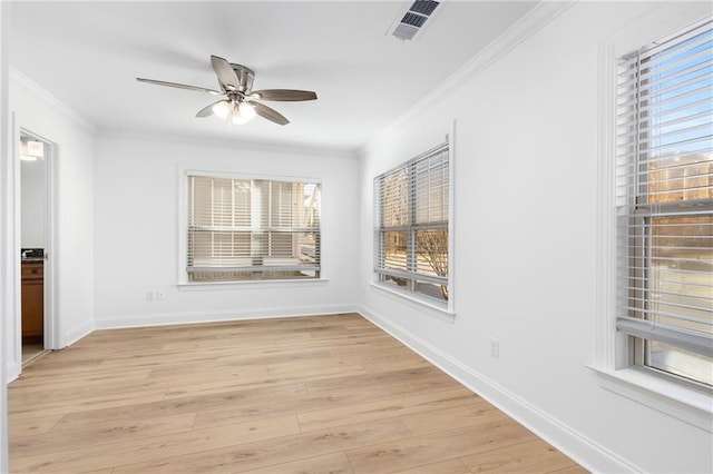 spare room with ceiling fan, light hardwood / wood-style floors, and ornamental molding